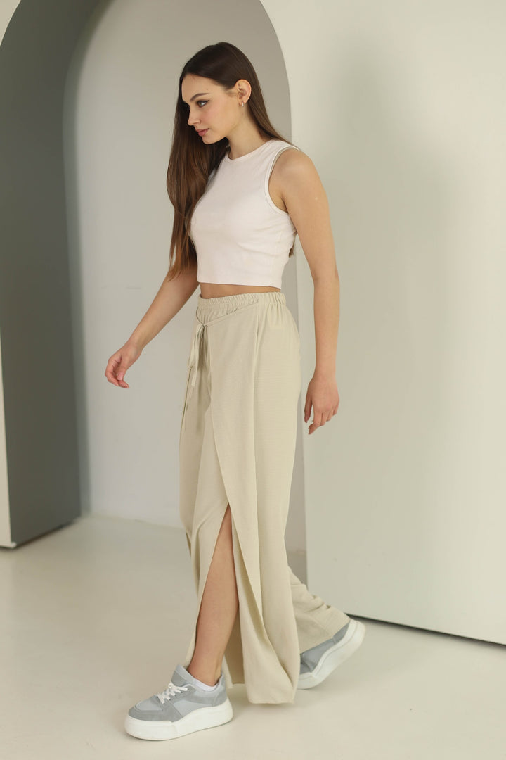 Beige split front wide leg trousers