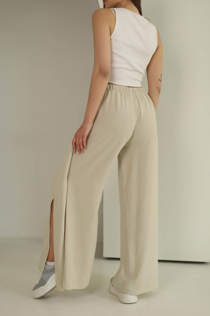 Beige split front wide leg trousers